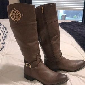Brown riding boot with gold accent, size 10